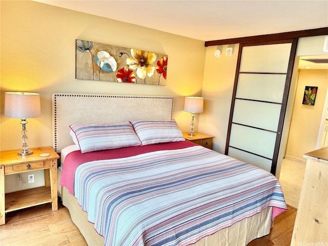 bedroom with wood finished floors