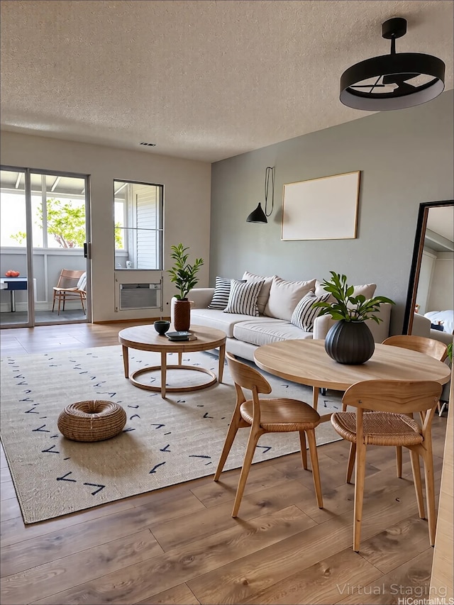 98-833 Noelani St Unit 155, Pearl City, HI 96782 - living area with light wood-style flooring and a textured ceiling