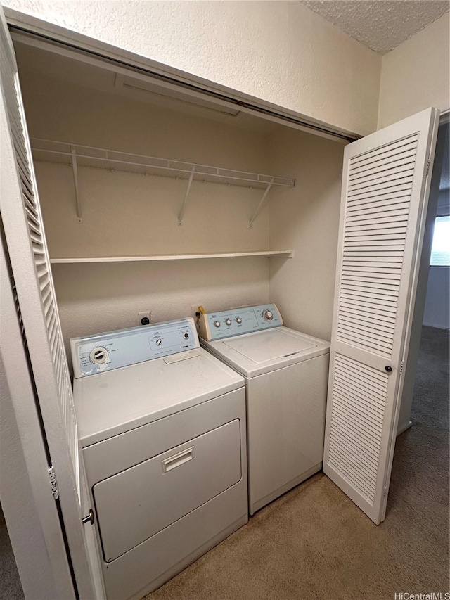 98-833 Noelani St Unit 155, Pearl City, HI 96782 - washroom with independent washer and dryer, a textured ceiling, and light colored carpet