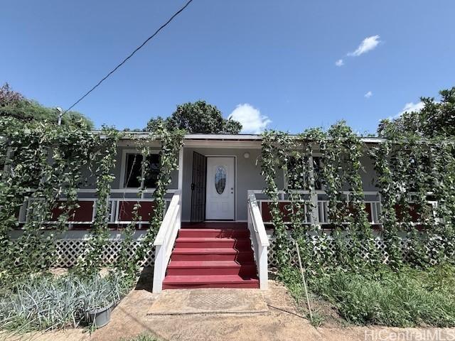 doorway to property with a porch