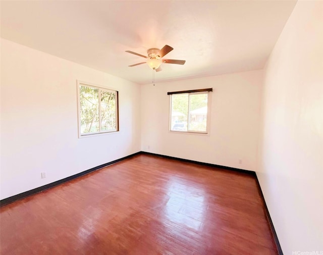 84-921 Lahaina St Unit A, Waianae, HI 96792 - empty room featuring plenty of natural light, ceiling fan, wood finished floors, and baseboards