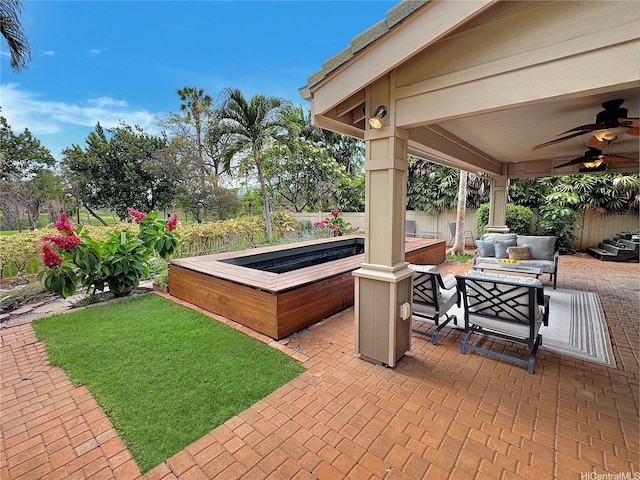 view of patio with ceiling fan, outdoor lounge area, and a fenced backyard