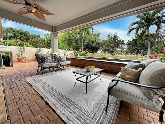 view of patio / terrace with a ceiling fan and fence