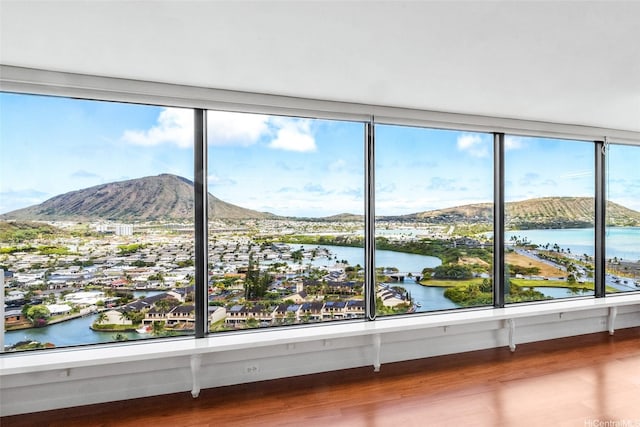250 Kawaihae St Unit 18D, Honolulu, HI 96825 - detailed view of wood finished floors and a water and mountain view