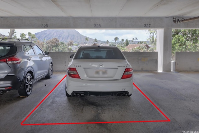 250 Kawaihae St Unit 18D, Honolulu, HI 96825 - covered parking lot featuring a mountain view