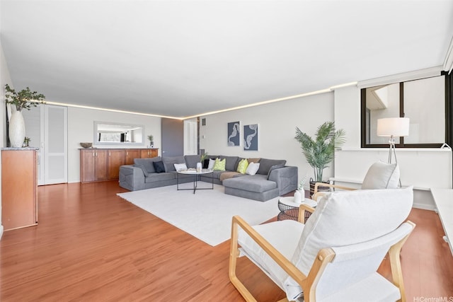 250 Kawaihae St Unit 18D, Honolulu, HI 96825 - living room featuring light wood finished floors