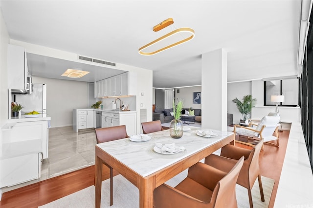 250 Kawaihae St Unit 18D, Honolulu, HI 96825 - dining room with light wood-style floors