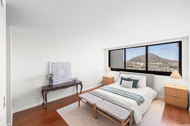 250 Kawaihae St Unit 18D, Honolulu, HI 96825 - bedroom with light wood-type flooring and baseboards