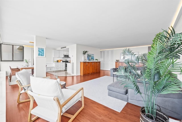 250 Kawaihae St Unit 18D, Honolulu, HI 96825 - living area featuring light wood finished floors