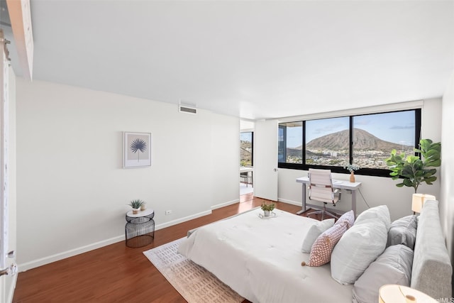 250 Kawaihae St Unit 18D, Honolulu, HI 96825 - bedroom featuring wood finished floors and baseboards
