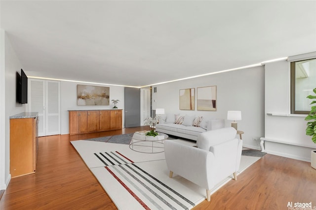 250 Kawaihae St Unit 18D, Honolulu, HI 96825 - living room with light wood-style floors