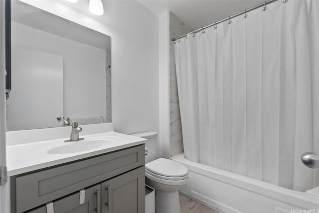 3045 Ala Napuaa Pl Unit 311, Honolulu, HI 96818 - bathroom featuring toilet, vanity, shower / bathtub combination with curtain, and wood finished floors