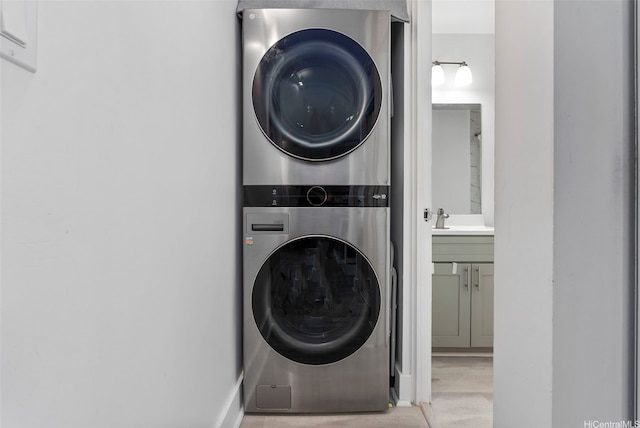 3045 Ala Napuaa Pl Unit 311, Honolulu, HI 96818 - washroom with stacked washer / drying machine and wood finished floors