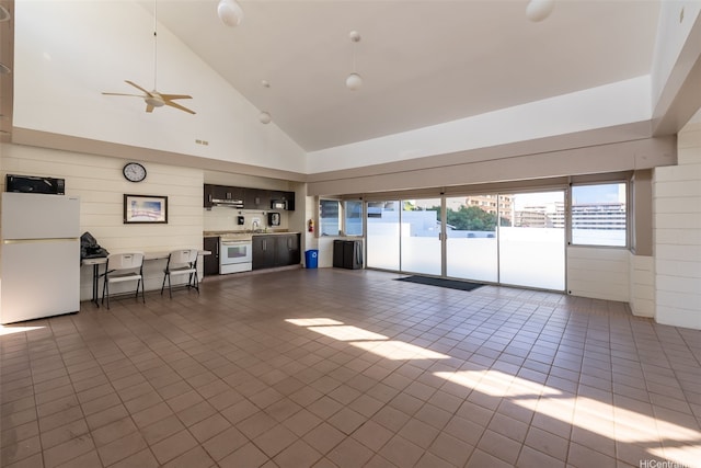 3045 Ala Napuaa Pl Unit 311, Honolulu, HI 96818 - tiled living room with a ceiling fan and high vaulted ceiling
