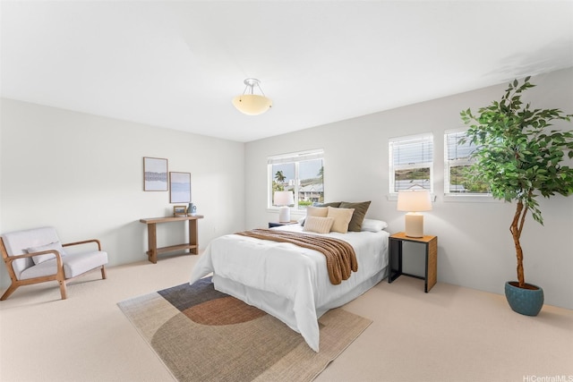 bedroom featuring light colored carpet