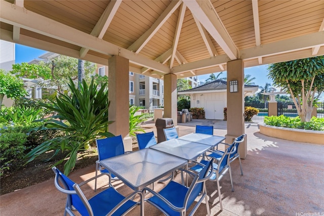 view of patio featuring fence and outdoor dining space