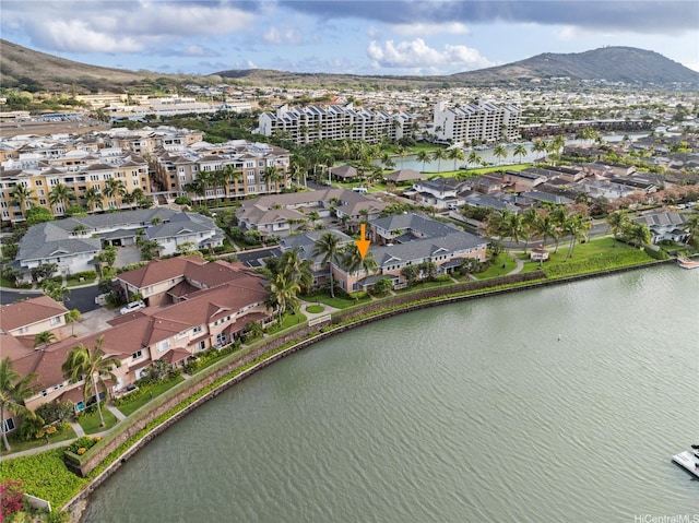 drone / aerial view with a water and mountain view