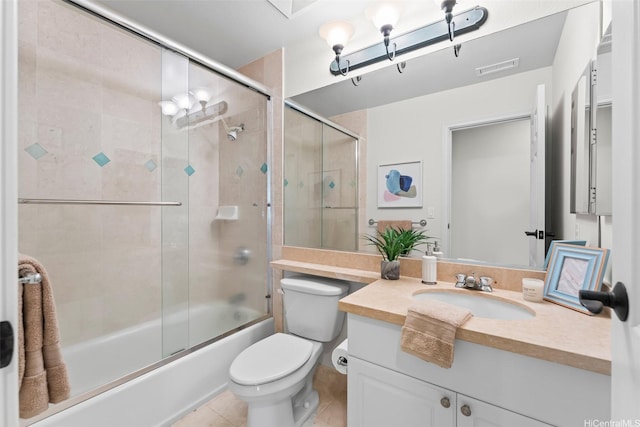 full bathroom with shower / bath combination with glass door, tile patterned flooring, vanity, toilet, and visible vents