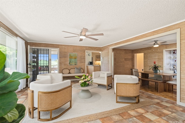 760 Onaha St, Honolulu, HI 96816 - living area with a ceiling fan, a textured ceiling, and stone finish flooring