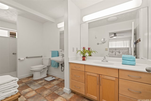 760 Onaha St, Honolulu, HI 96816 - bathroom featuring a sink, toilet, ceiling fan, and healthy amount of natural light