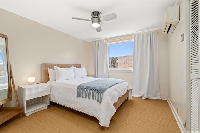 760 Onaha St, Honolulu, HI 96816 - bedroom featuring a wall unit AC, light wood-type flooring, a closet, and a ceiling fan