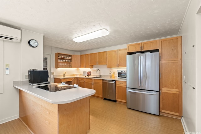 760 Onaha St, Honolulu, HI 96816 - kitchen with appliances with stainless steel finishes, a wall mounted AC, a sink, light countertops, and light wood-style floors