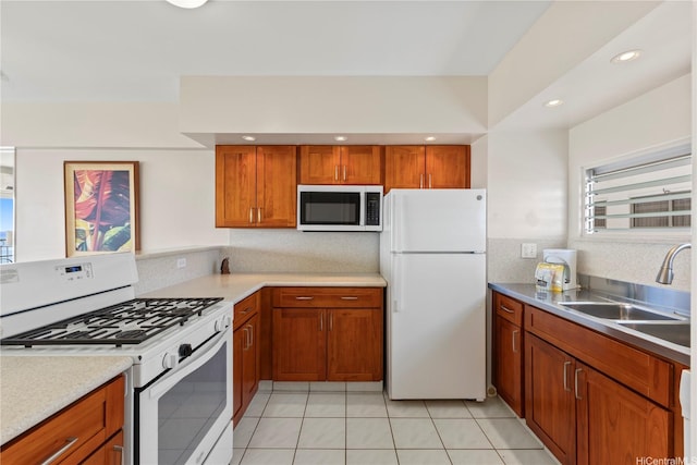 2161 Kalia Rd Unit 1112, Honolulu, HI 96815 - kitchen featuring white appliances, brown cabinets, light countertops, light tile patterned flooring, and recessed lighting