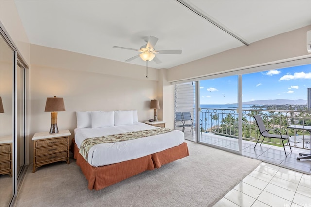 2161 Kalia Rd Unit 1112, Honolulu, HI 96815 - bedroom featuring access to outside, a closet, ceiling fan, light tile patterned flooring, and light colored carpet