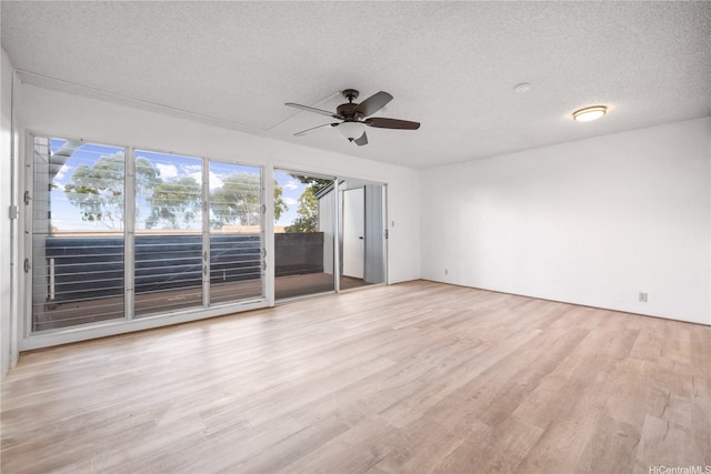 92-956 Makakilo Dr Unit 62, Kapolei, HI 96707 - spare room with light wood finished floors, a ceiling fan, and a textured ceiling