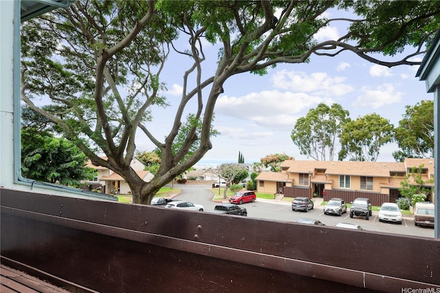 exterior space featuring a residential view and parking