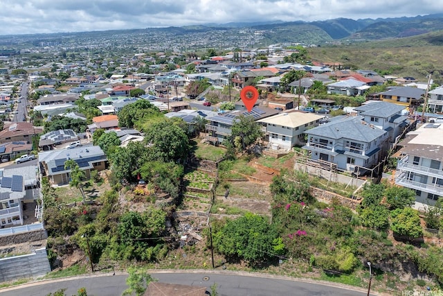 1180 Wanaka St, Honolulu, HI 96818 - aerial perspective of suburban area featuring a mountain backdrop