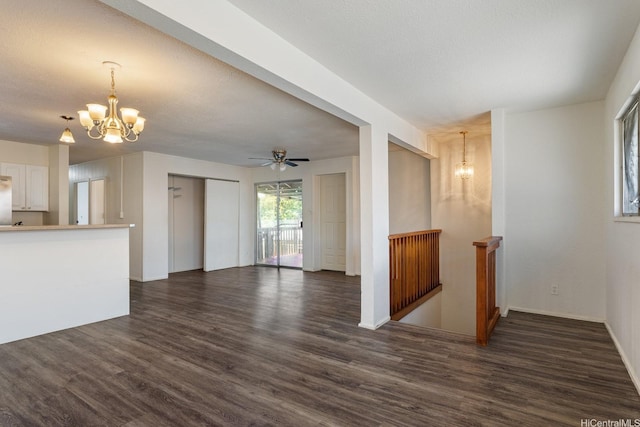 1180 Wanaka St, Honolulu, HI 96818 - unfurnished living room with a chandelier, dark wood-style floors, a ceiling fan, and baseboards