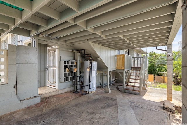 1180 Wanaka St, Honolulu, HI 96818 - view of patio featuring water heater and stairway