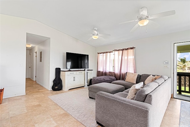 living room with a ceiling fan and vaulted ceiling