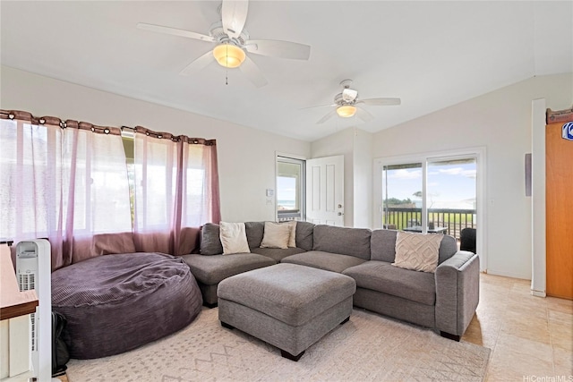 living area featuring ceiling fan and vaulted ceiling
