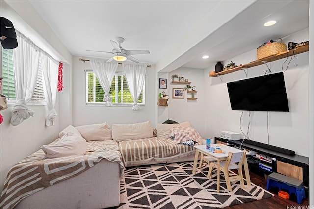 living room featuring a ceiling fan, recessed lighting, and wood finished floors