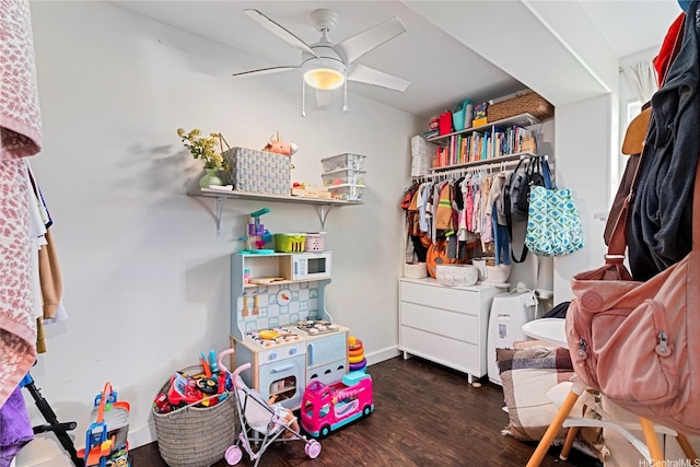 walk in closet featuring ceiling fan and wood finished floors