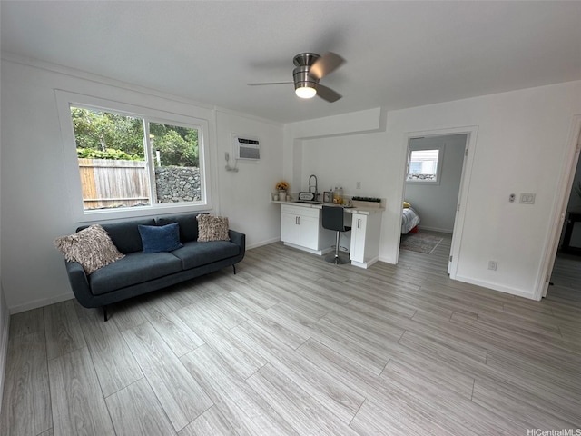 44-665 Kaneohe Bay Dr, Kaneohe, HI 96744 - living room with a ceiling fan, baseboards, and light wood-type flooring