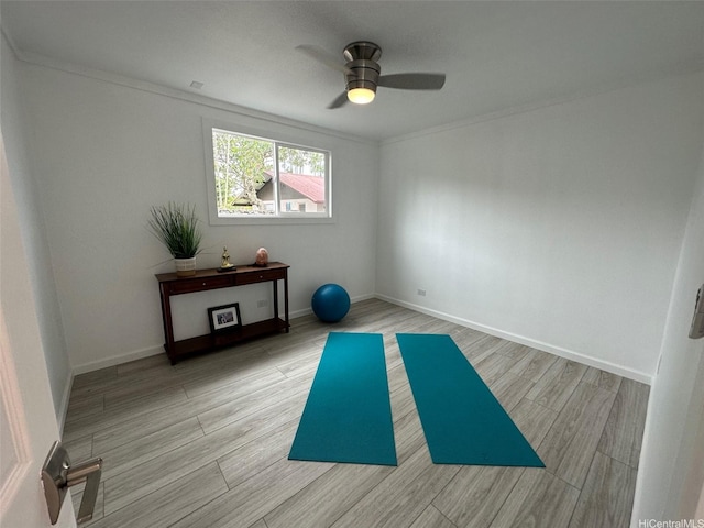 44-665 Kaneohe Bay Dr, Kaneohe, HI 96744 - exercise room featuring a ceiling fan, wood finished floors, crown molding, and baseboards