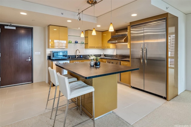 1200 Queen Emma St Unit 1401, Honolulu, HI 96813 - kitchen with a kitchen bar, a sink, dark countertops, stainless steel appliances, and under cabinet range hood