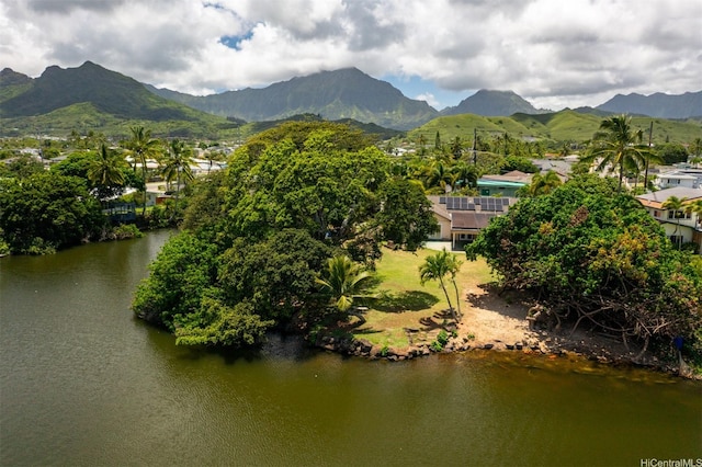 birds eye view of property featuring a water and mountain view