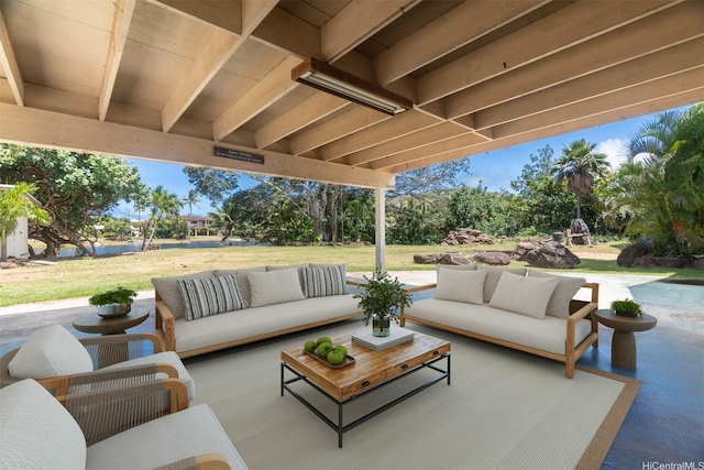 view of patio with an outdoor living space and a water view