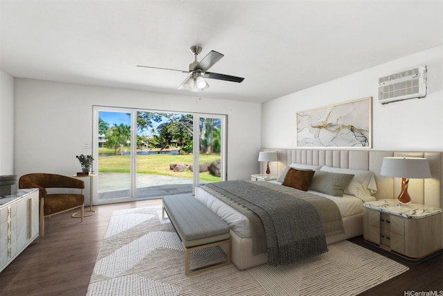 bedroom with access to outside, wood finished floors, a ceiling fan, and a wall mounted AC
