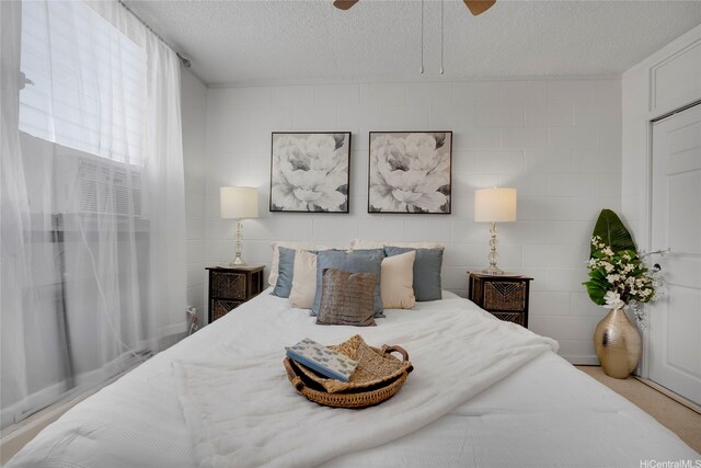 98-114 Lipoa Pl Unit 209, Aiea, HI 96701 - bedroom featuring a textured ceiling and a ceiling fan