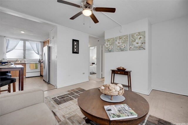 98-114 Lipoa Pl Unit 209, Aiea, HI 96701 - living area featuring a ceiling fan and baseboards