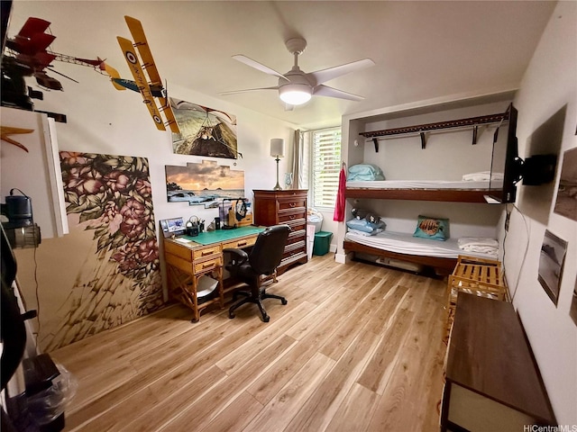 home office featuring a ceiling fan and light wood-style flooring