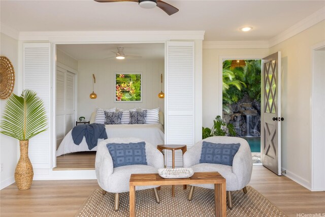 44-102 Kauinohea Pl, Kaneohe, HI 96744 - living area with ceiling fan, light wood-type flooring, baseboards, and crown molding