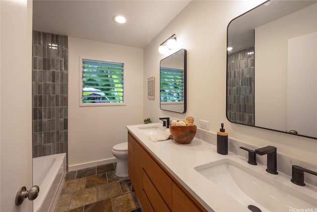 44-102 Kauinohea Pl, Kaneohe, HI 96744 - bathroom featuring stone finish floors, toilet, double vanity, baseboards, and recessed lighting