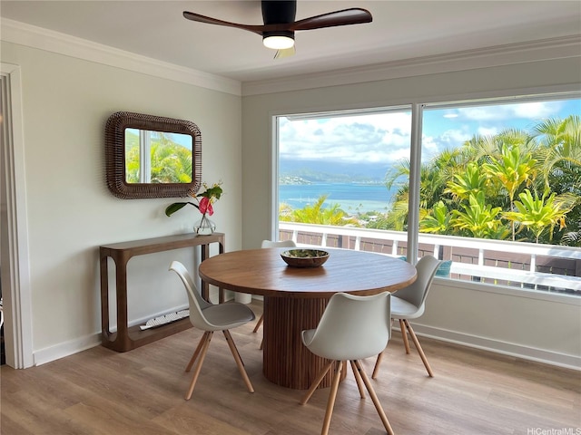44-102 Kauinohea Pl, Kaneohe, HI 96744 - dining area featuring light wood finished floors, a water view, healthy amount of natural light, and crown molding