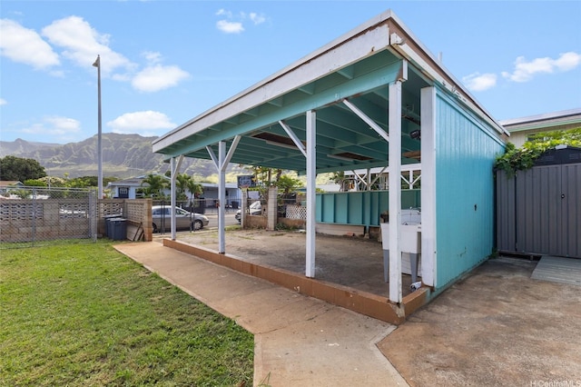 84-541 Nukea St, Waianae, HI 96792 - view of patio with a detached carport, fence, and a mountain view